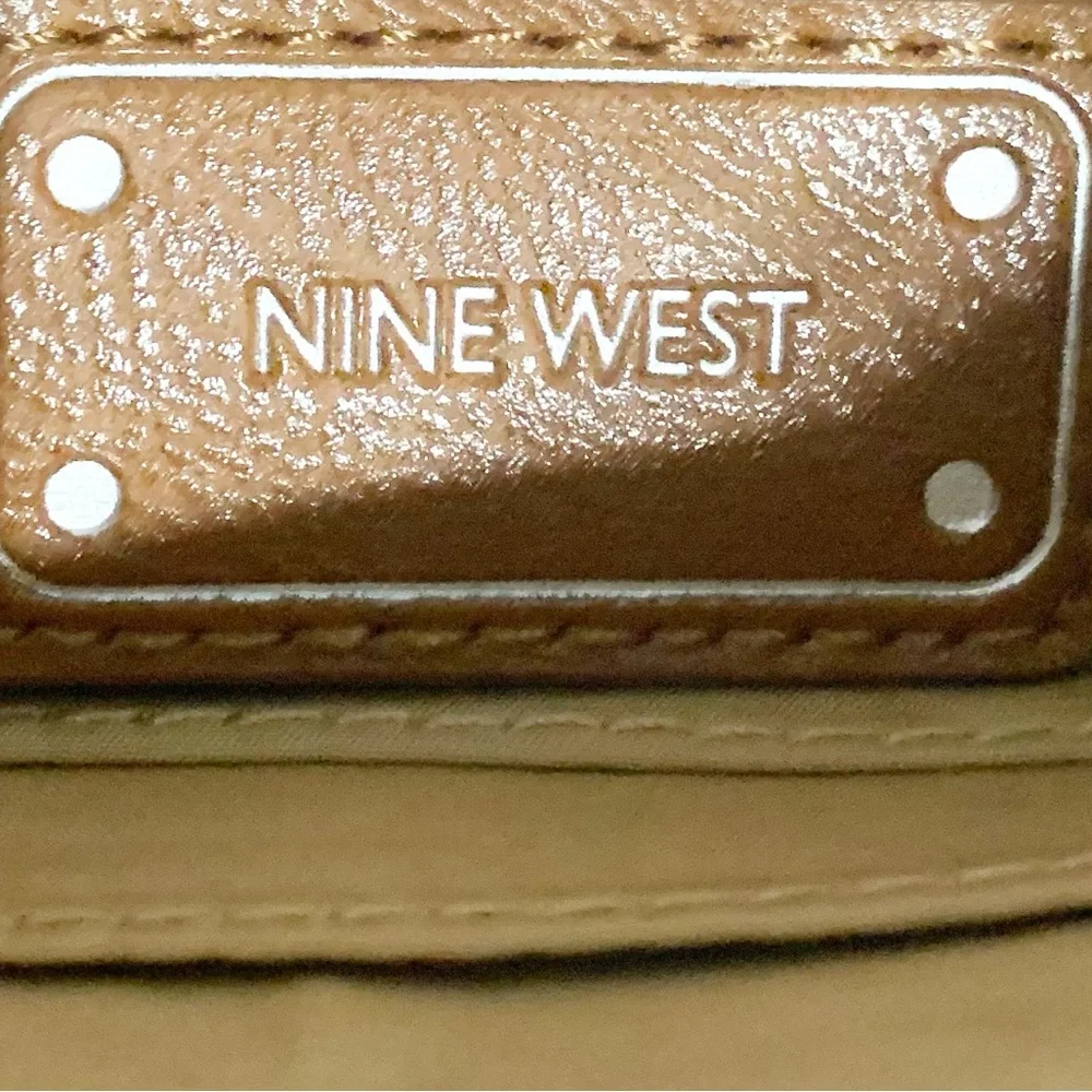 Nine West Faux Leather Wristlet Fully Line in Tan Print Studded Logo Plate Brown